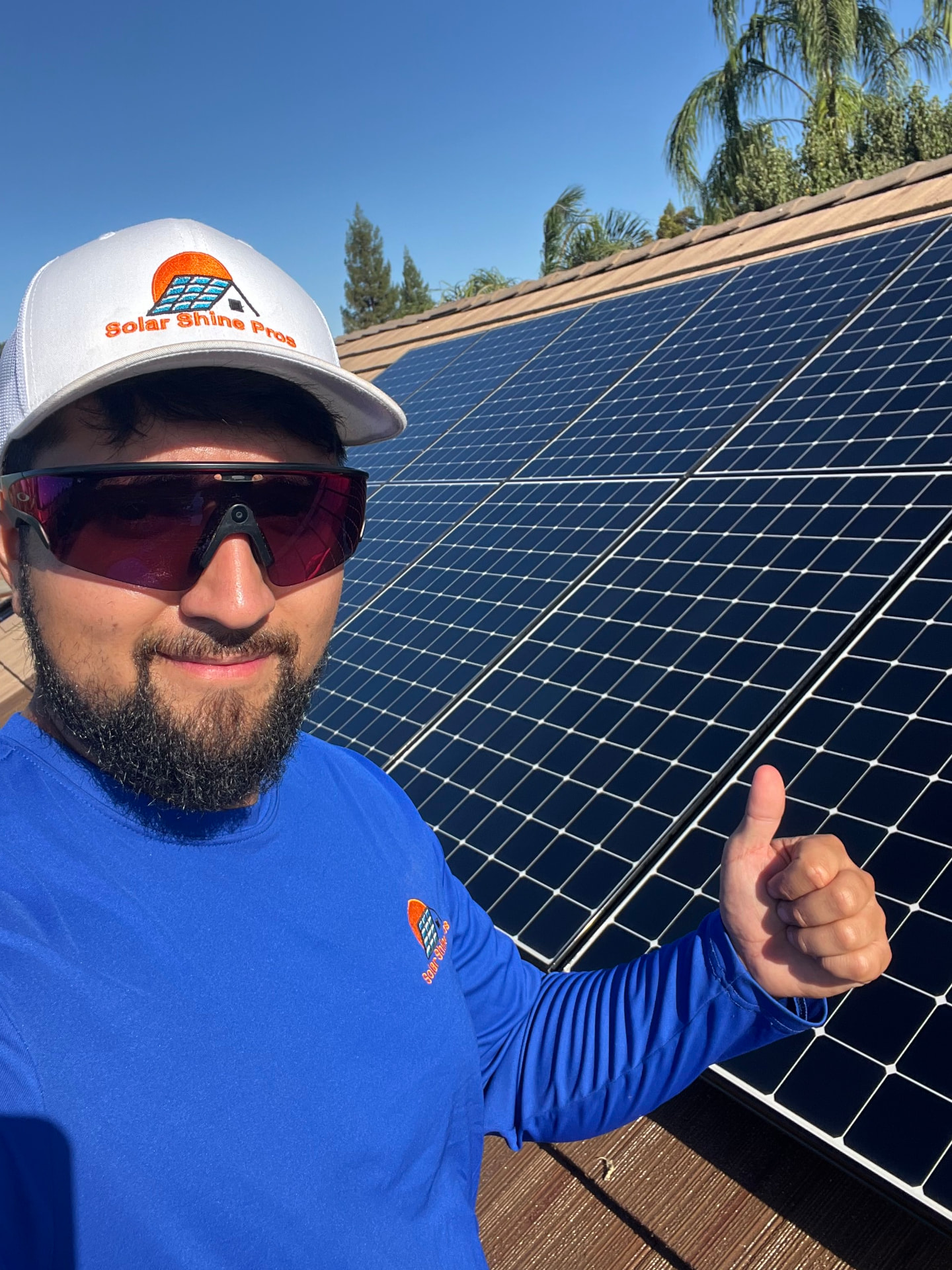 Ruben Solorzano, owner of Solar Shine Pros, on a rooftop after cleaning a solar array