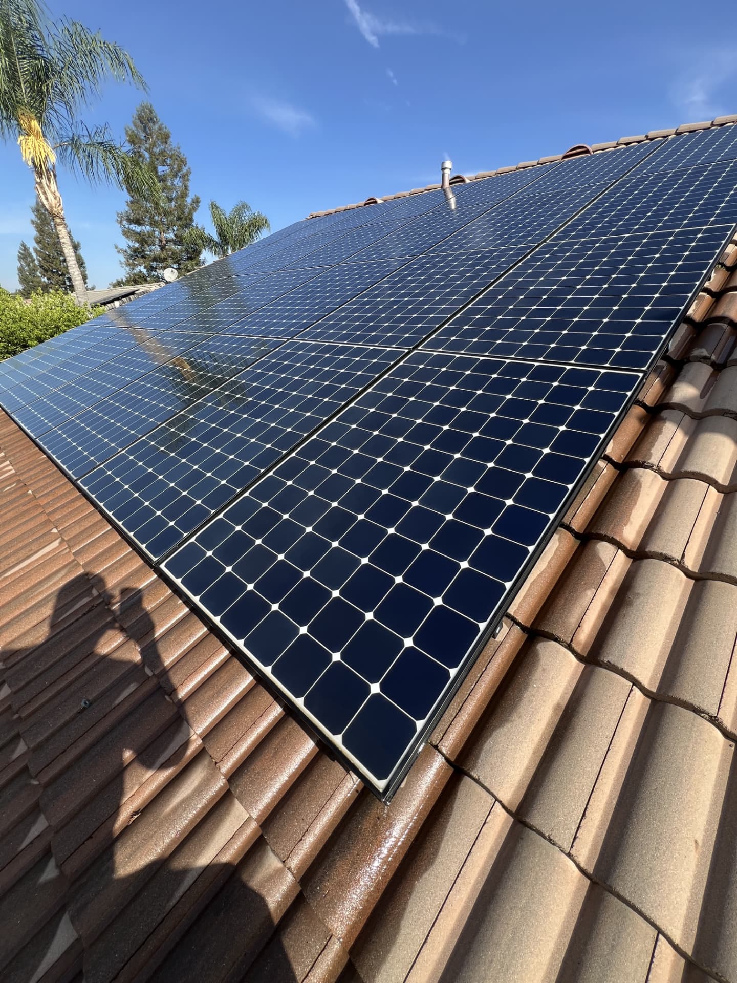 Spotless solar array on a tile roof after a deionized water cleaning