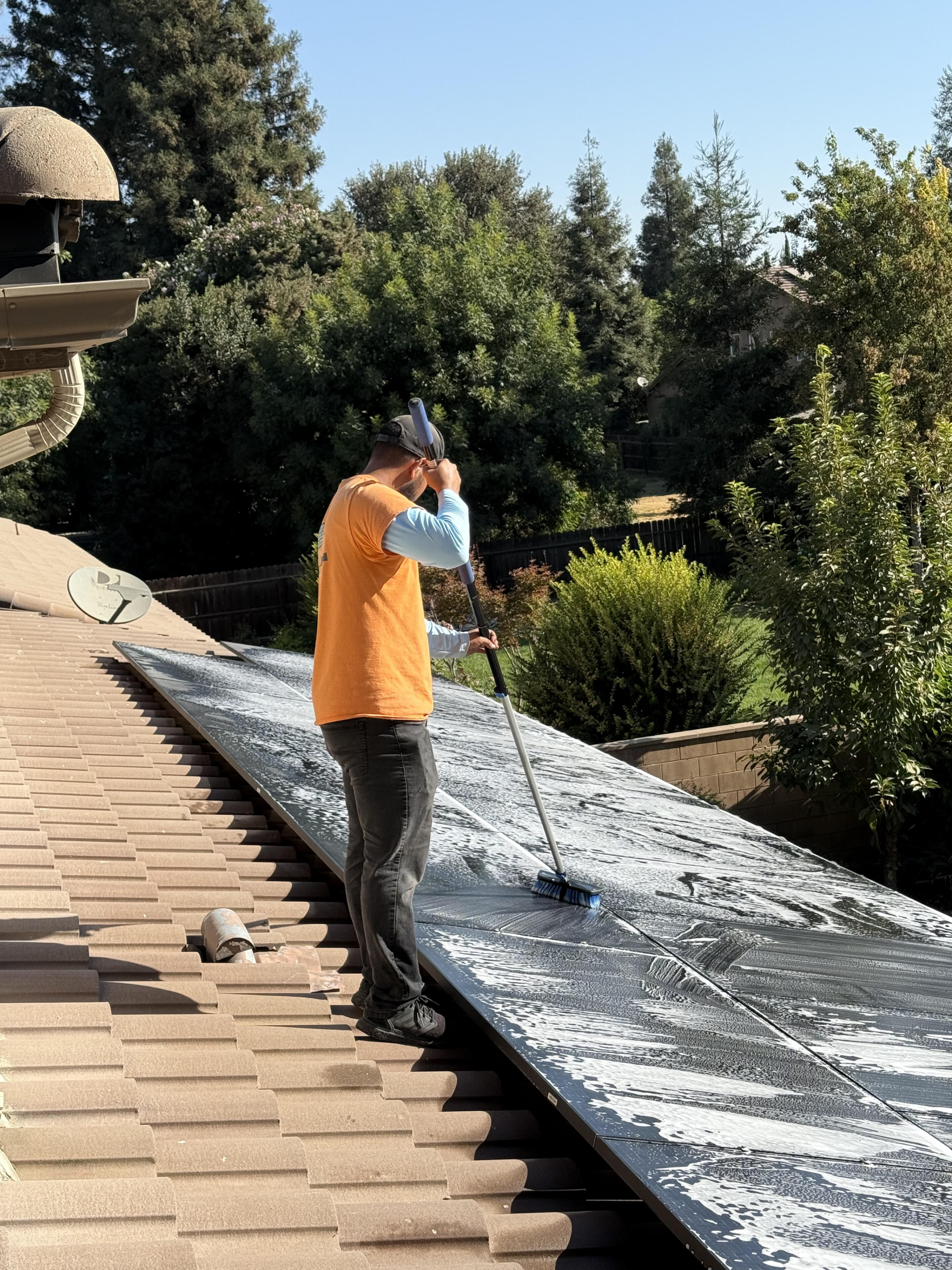 Solar Shine Pros owner cleaning solar panels in California's Central Valley